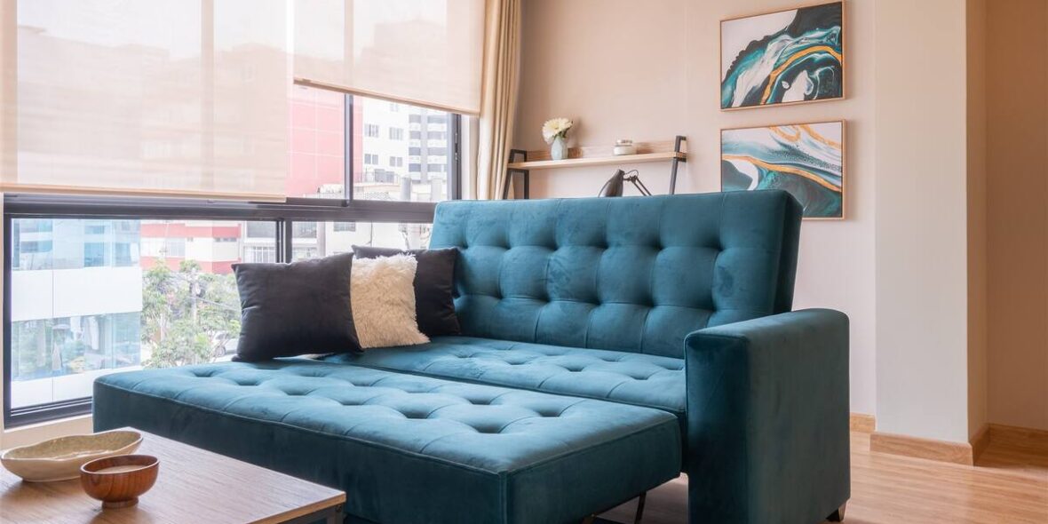 Singular apartment sofa bed by the window